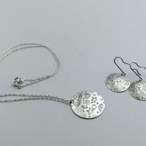 Chased earrings and pendant jewelry set